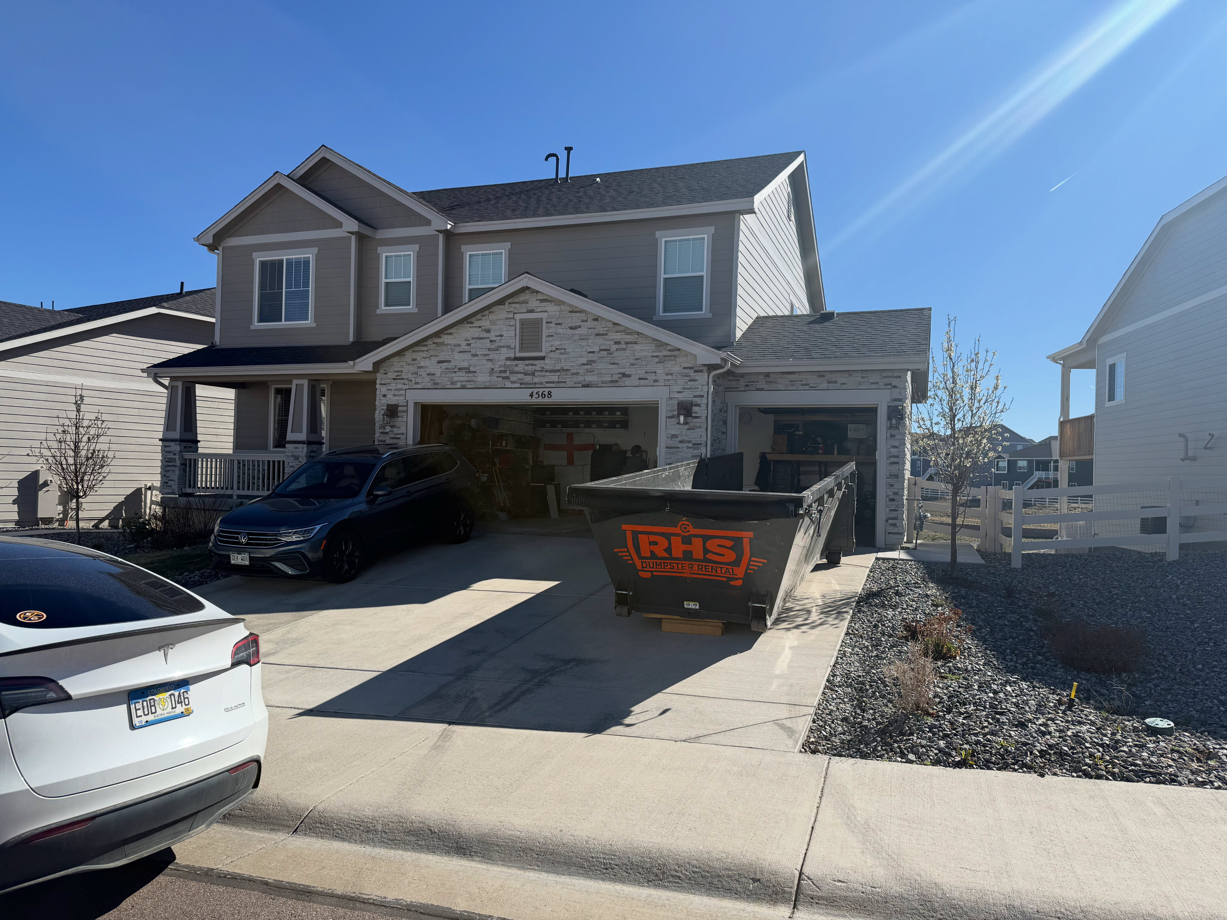 RHS dumpster on residential driveway