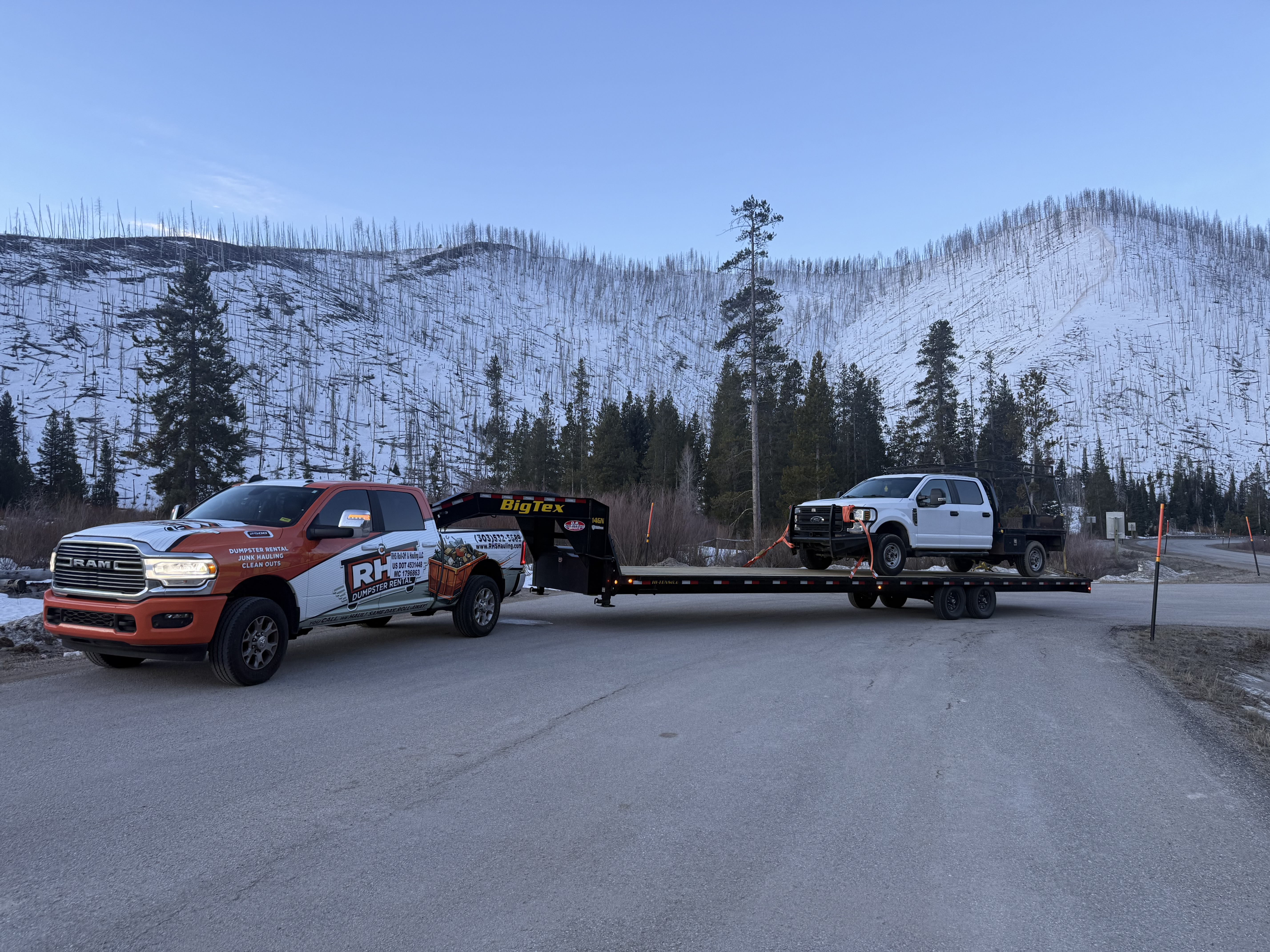 RHS Ram 2500 hauling truck on Big Tex gooseneck through Colorado mountains